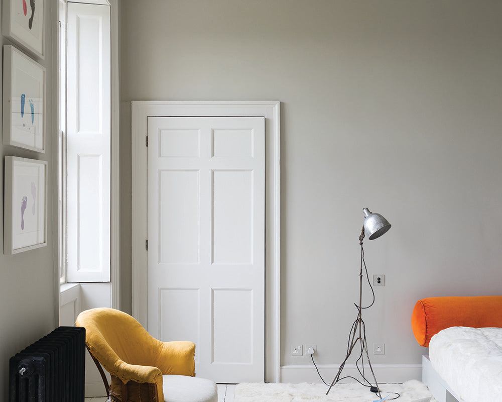 Skimming Stone 241 paint by Farrow & Ball in a living room with retro furnishings