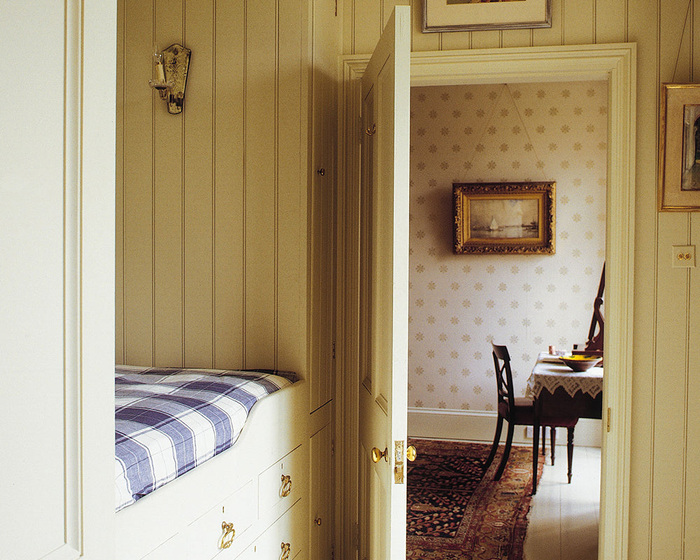 Farrow and Ball Brockhampton Star Wallpaper in a bedroom