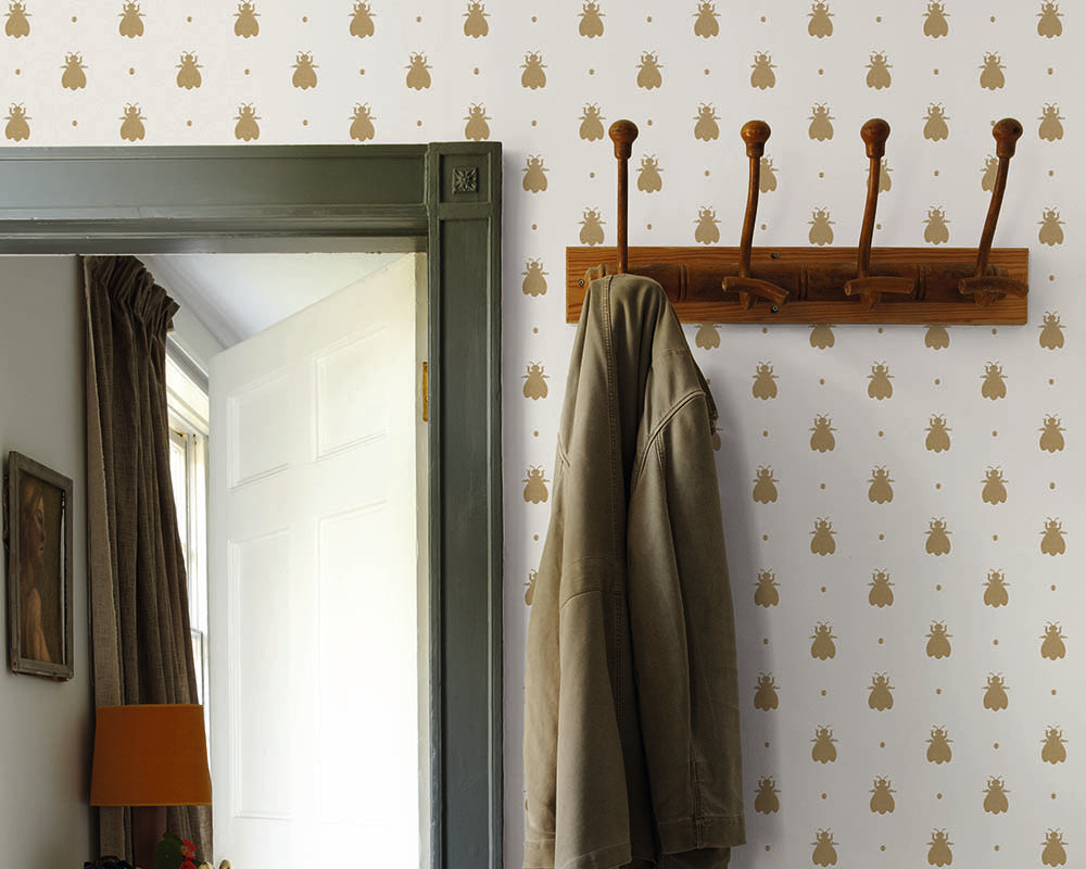 Farrow and Ball Bumble Bee Wallpaper in a hallway with coat hooks
