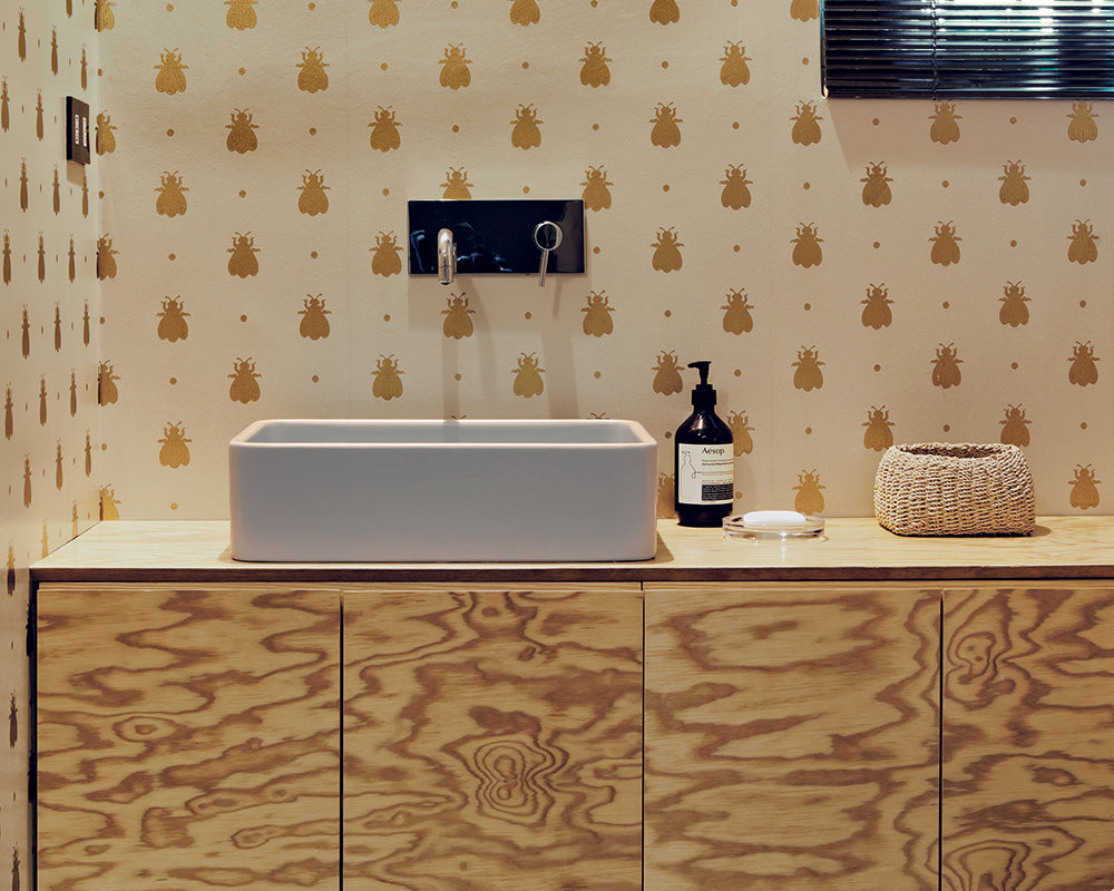Farrow and Ball Bumble Bee Wallpaper in a bathroom