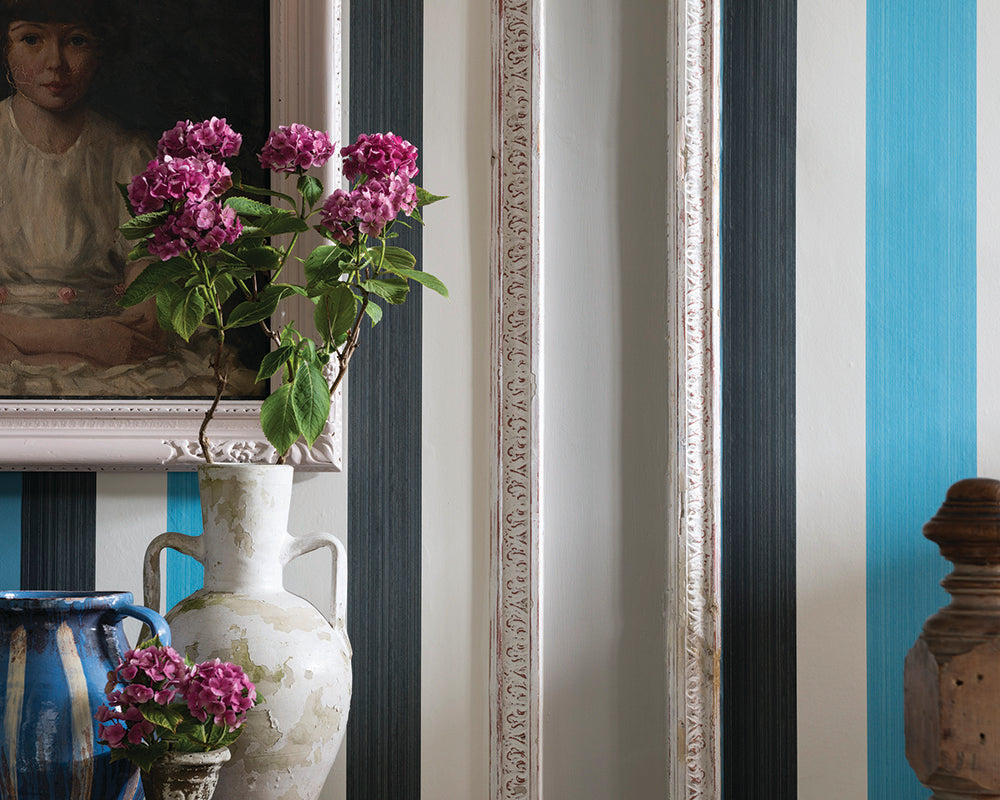 Farrow and Ball Chromatic Stripe Wallpaper in a room with a vase 