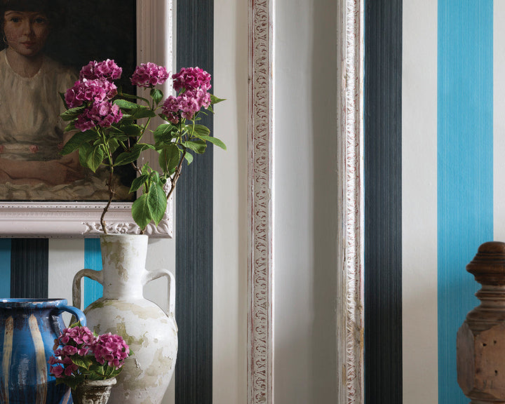Farrow and Ball Chromatic Stripe Wallpaper in a room with a vase 
