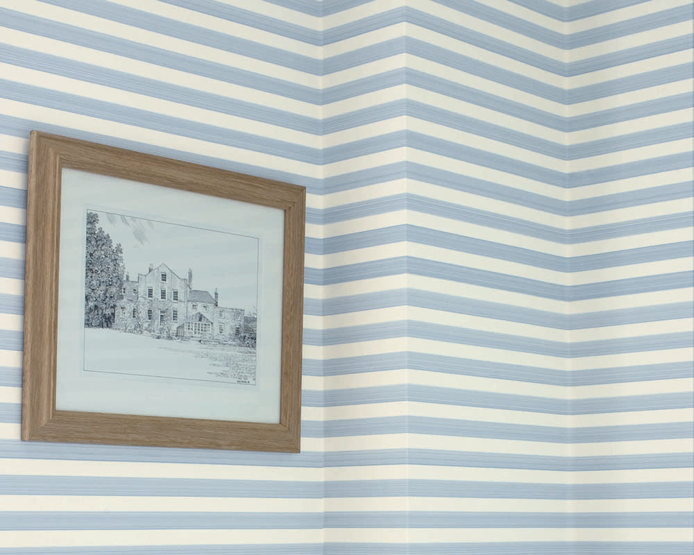 Farrow and Ball Closet Stripe Wallpaper in a hallway with artwork