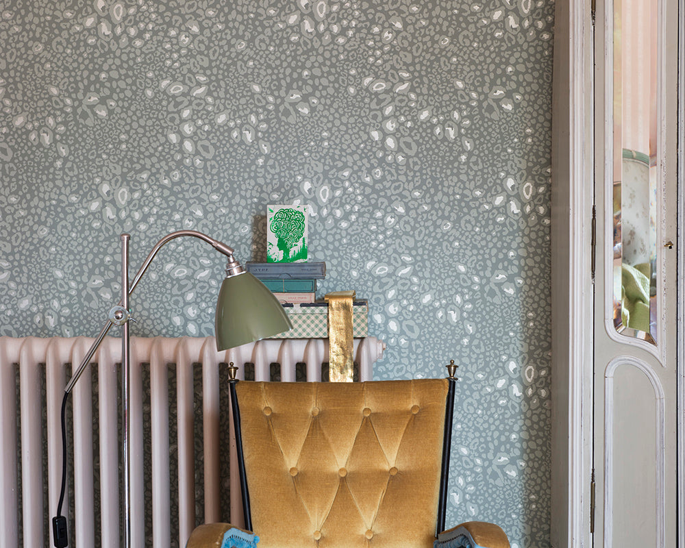 Farrow and Ball Ocelot Wallpaper with a cast iron radiator