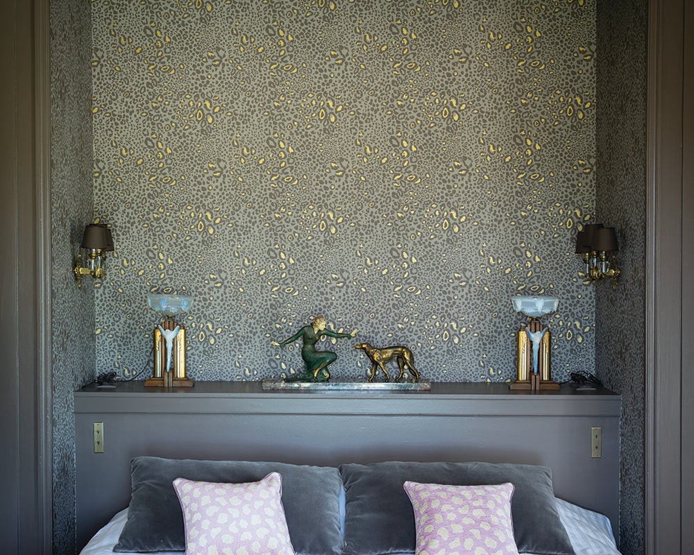 Farrow and Ball Ocelot Wallpaper in a bedroom as a headboard