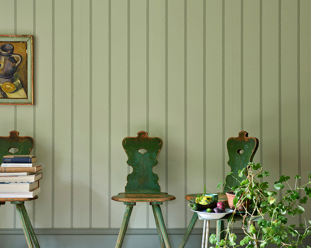Farrow and Ball Petal Stripe Wallpaper in a room with green chairs