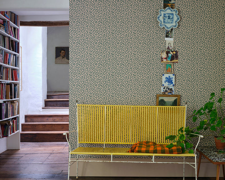 Farrow and Ball Renaissance Leaves Wallpaper in a room with a yellow bench
