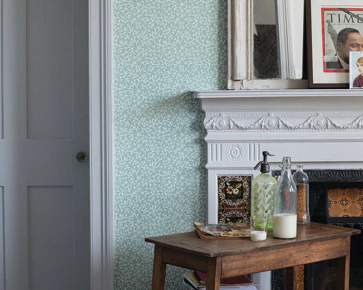 Farrow and Ball Samphire Wallpaper with a fireplace