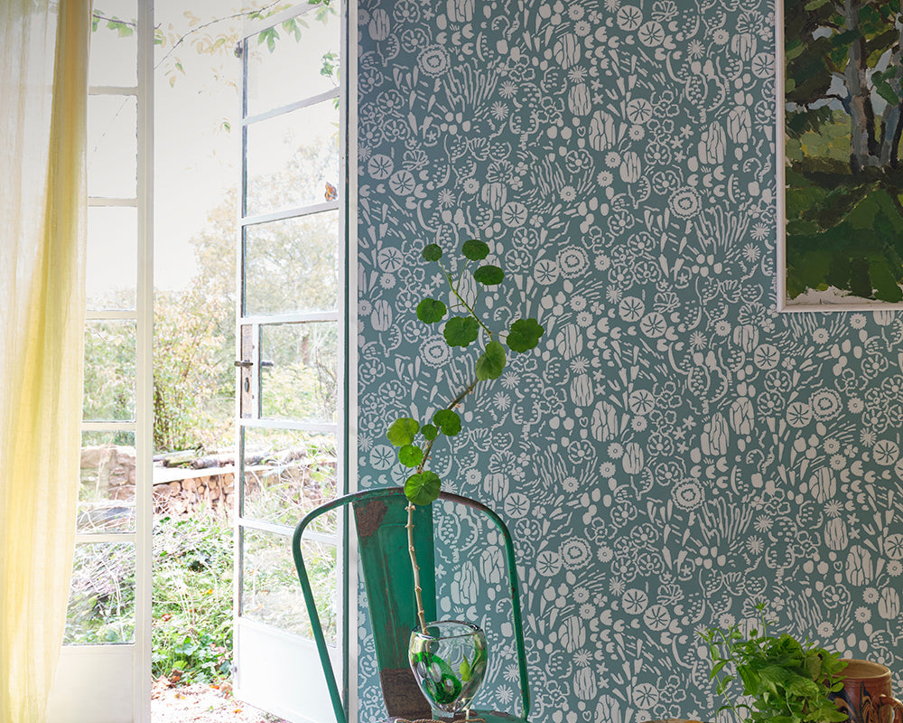 Farrow and Ball Atacama Wallpaper 5801 in a room with a chair