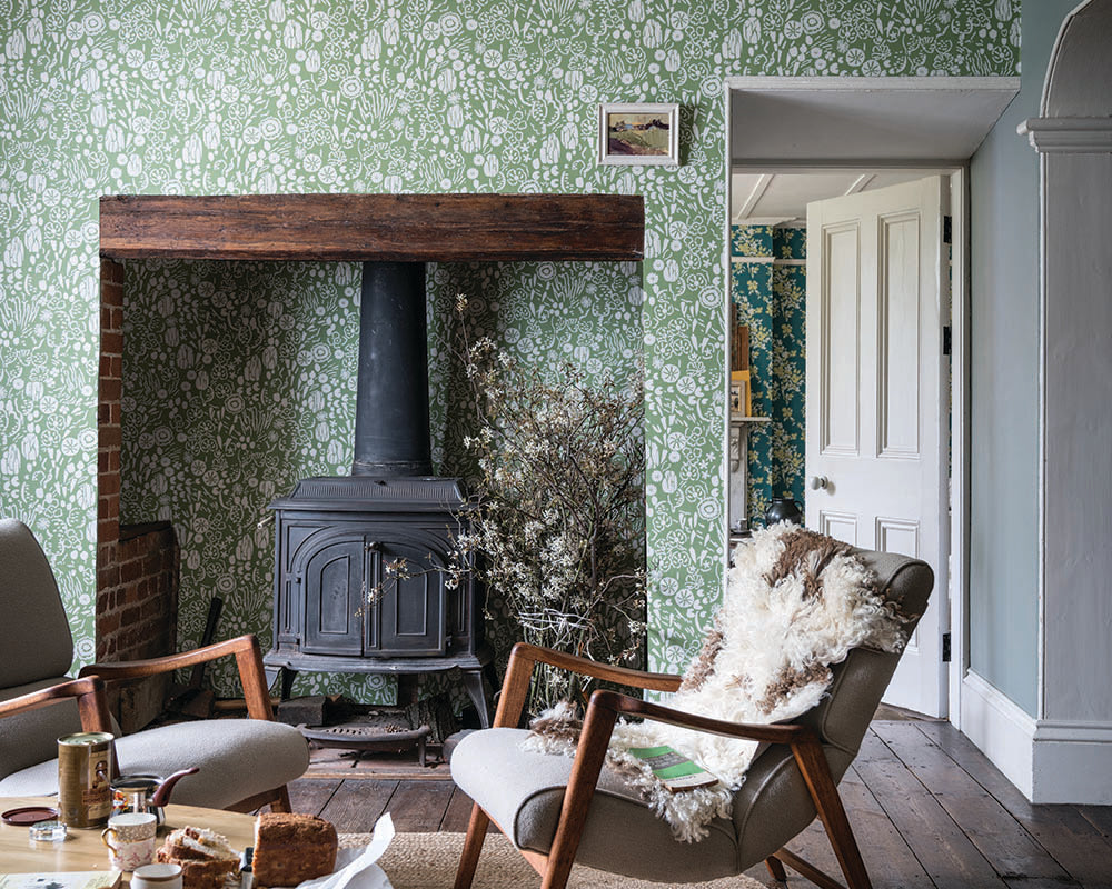 Farrow and Ball Atacama Wallpaper 5804 in a living room with large fireplace