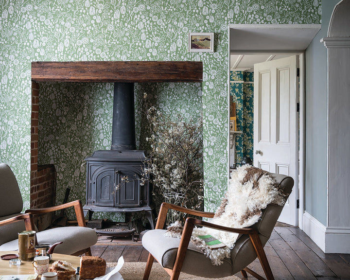 Farrow and Ball Atacama Wallpaper 5804 in a living room with large fireplace