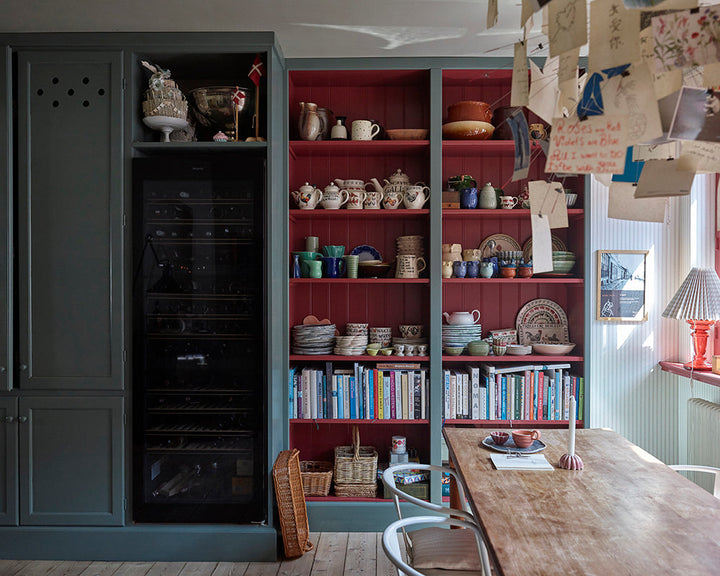 Eating Room Red 43 paint by Farrow & Ball used on the inside of a book shelf