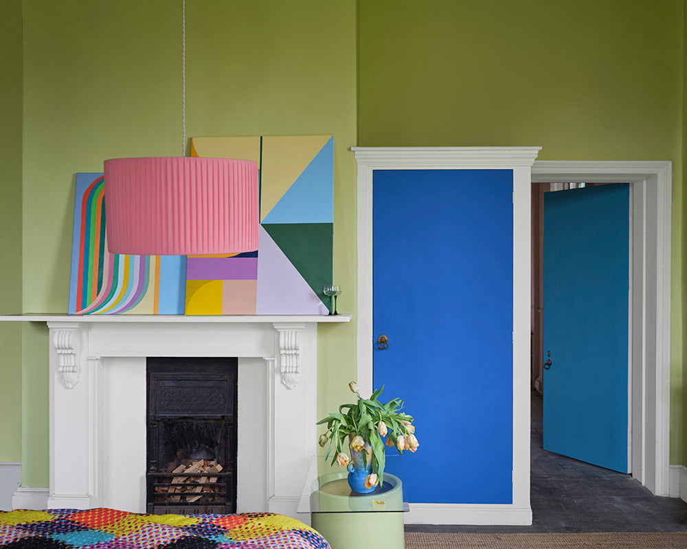Hog Plum CB1 paint by Farrow & Ball in a living room with blue door
