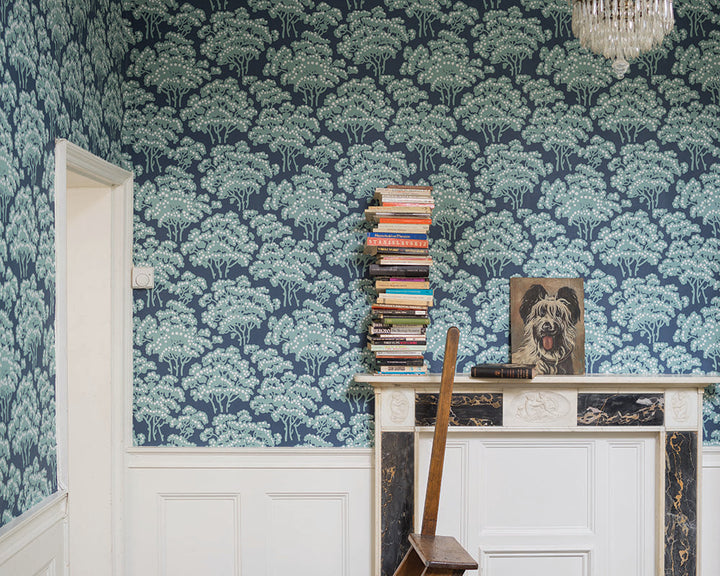 Farrow and Ball Hornbeam Wallpaper 5007 in a living room with side table