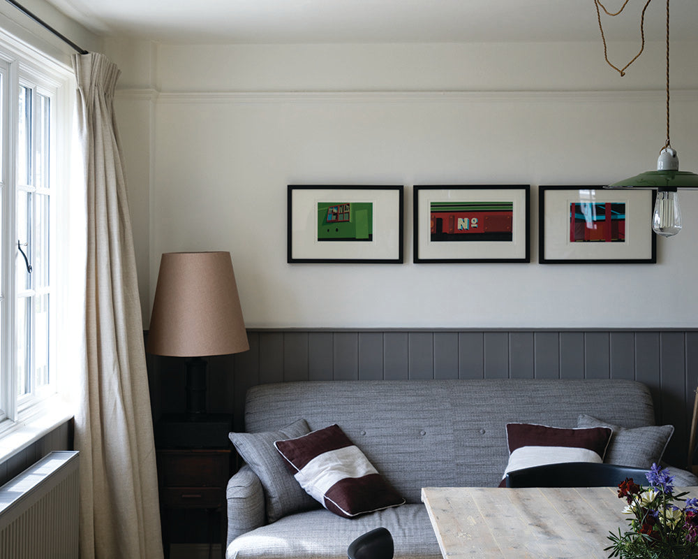 Mole's Breath 276 paint by Farrow & Ball on cladding in a living room 