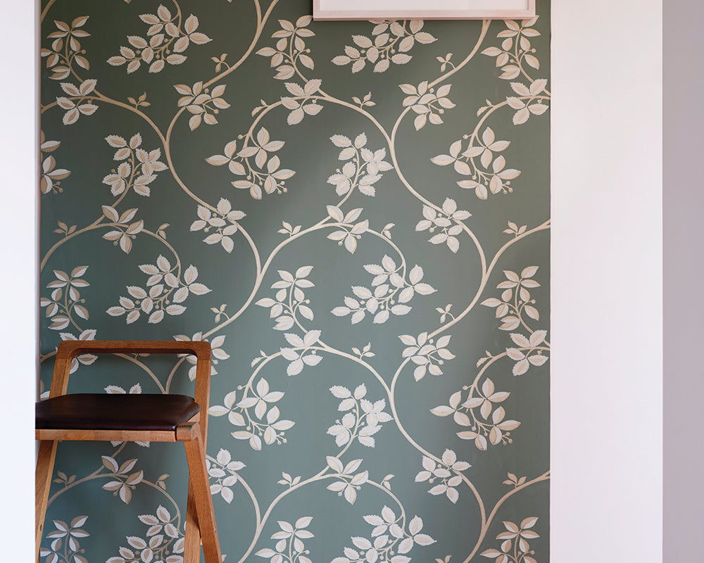 Farrow and Ball Ringwold Wallpaper 1654 in a hallway with a chair