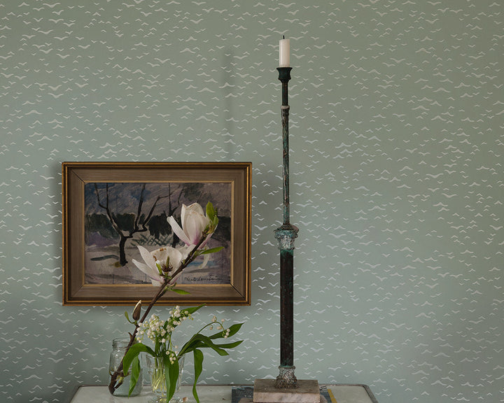 Farrow and Ball Yukutori Wallpaper 4303 with a candlestick and artwork