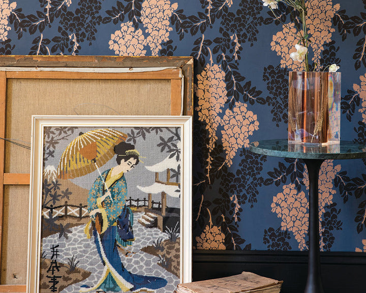 Farrow and Ball Wisteria Metallic Wallpaper 2223 on a wall with artwork