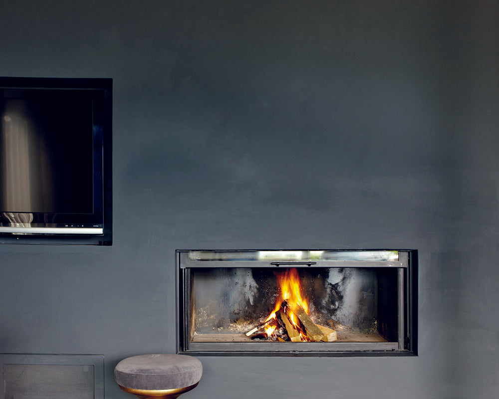 Off-Black 57 paint by Farrow & Ball on a wall with a modern fireplace