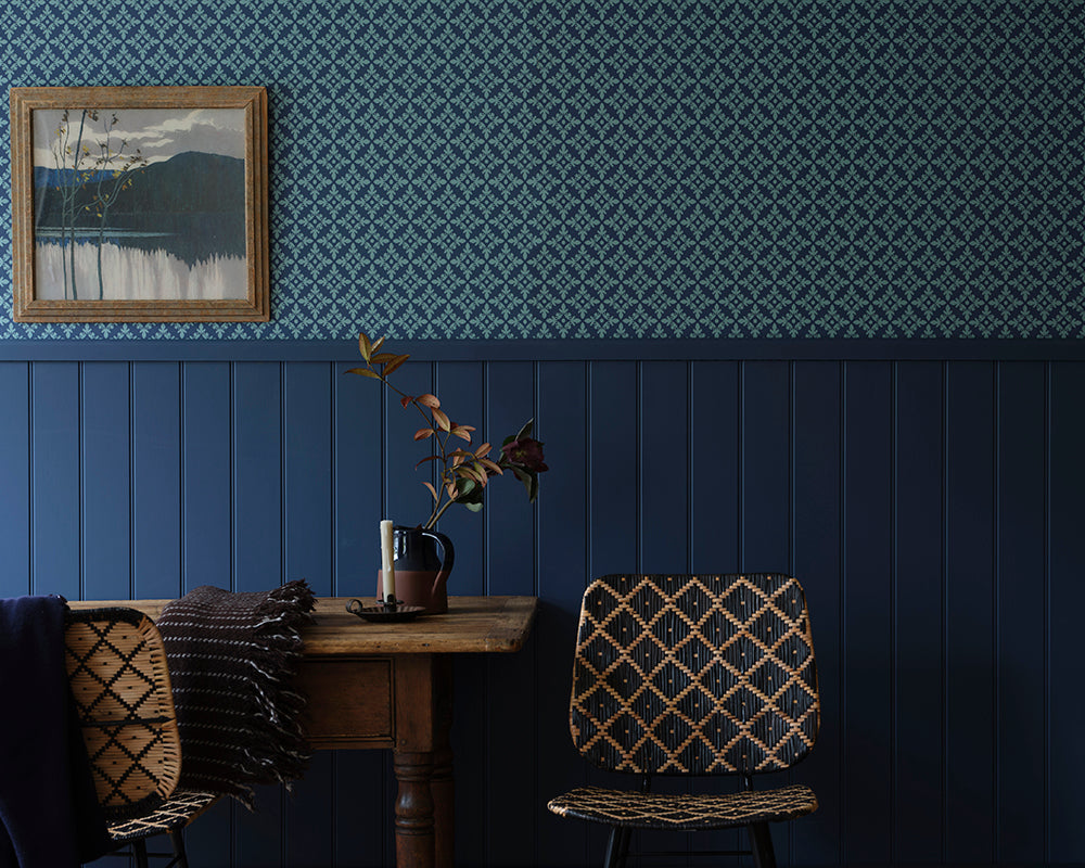 Stiffkey Blue 281 paint by Farrow & Ball in a living room with fireplace