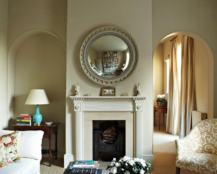 Stony Ground 211 paint by Farrow & Ball in a living room with a fireplace