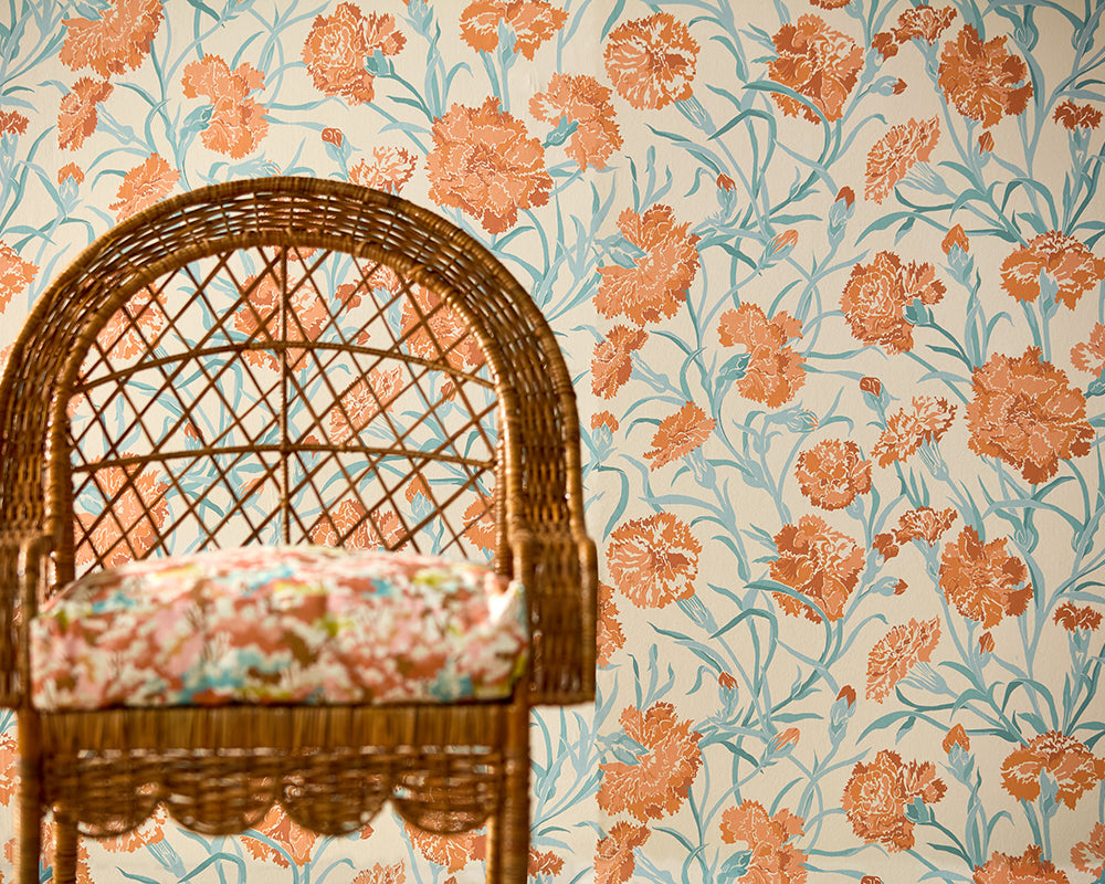 Harlequin Fleur De Joie Wide Width Wallpaper on a wall with a wicker chair