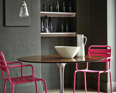 Little Greene Leather 191 Paint on dining chairs with a dark background