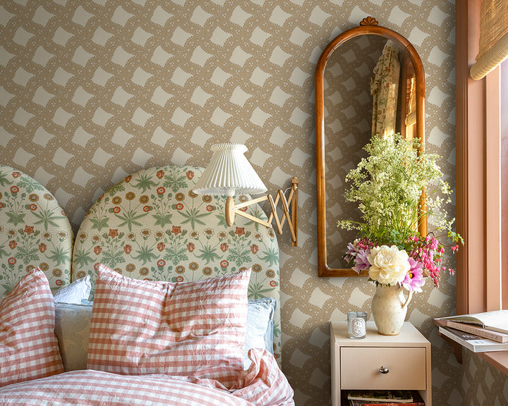 Sandberg Annie Wallpaper in decorative bedroom with floral headboard, checkered pillows, and a mirror on the wall.
