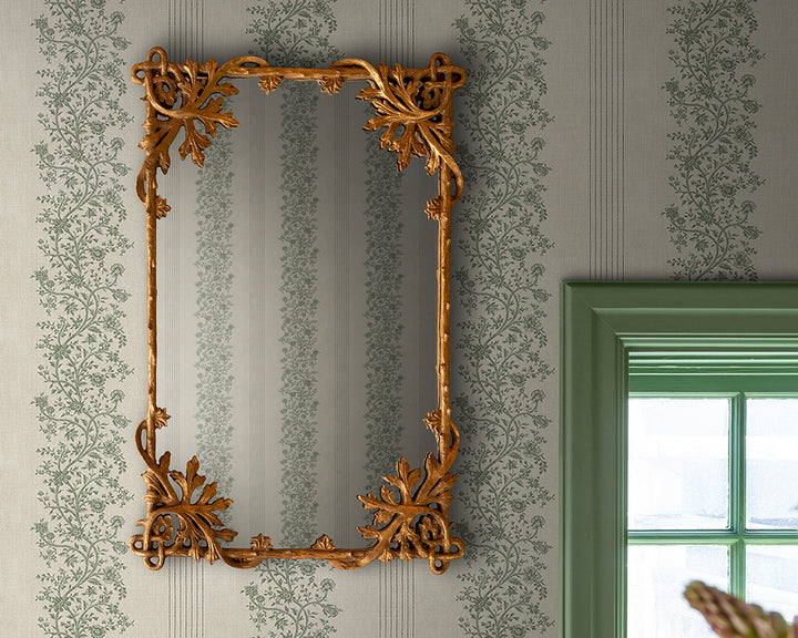 Sandberg Natalie Wallpaper with decorative gold mirror on a wall with floral patterns