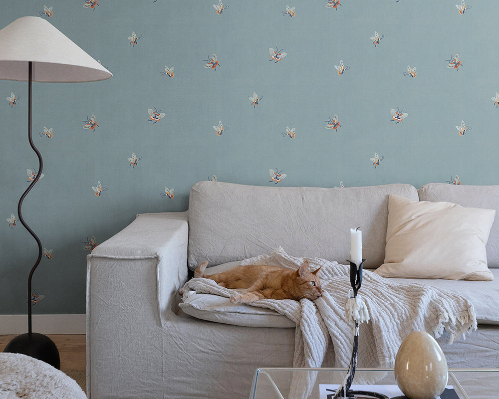 Sandberg Butterflies Wallpaper in Misty Blue in a living room set up