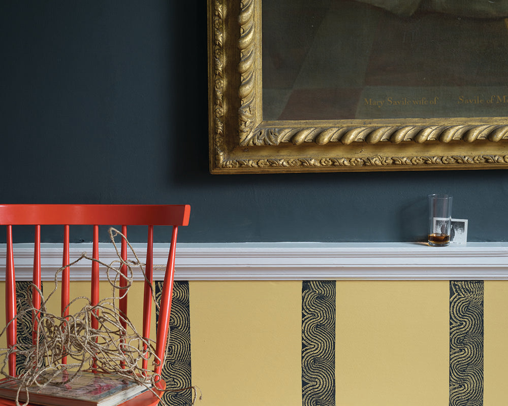 Citron 74 paint by Farrow & Ball used below architrave on a wall