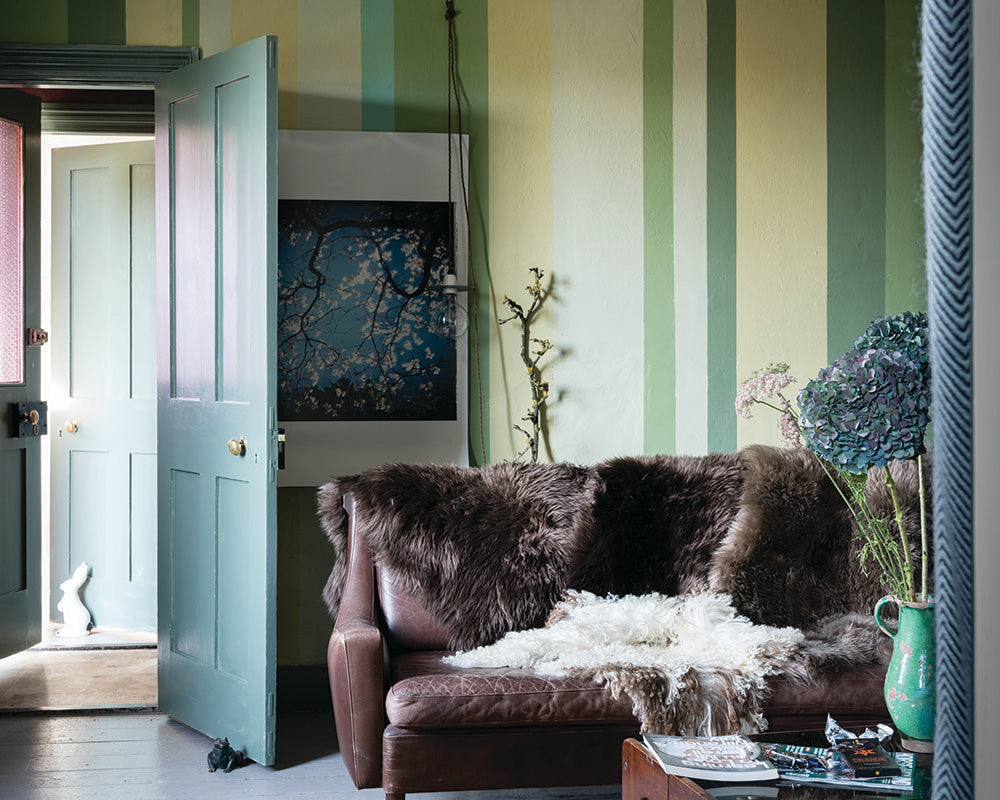 Cooking Apple Green 32 paint by Farrow & Ball used as part of a stripe pattern on a wall 