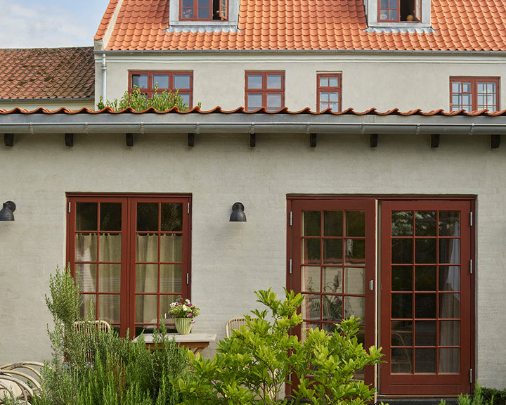 Etruscan Red 56 paint by Farrow & Ball on the window frames of a tuscan villa