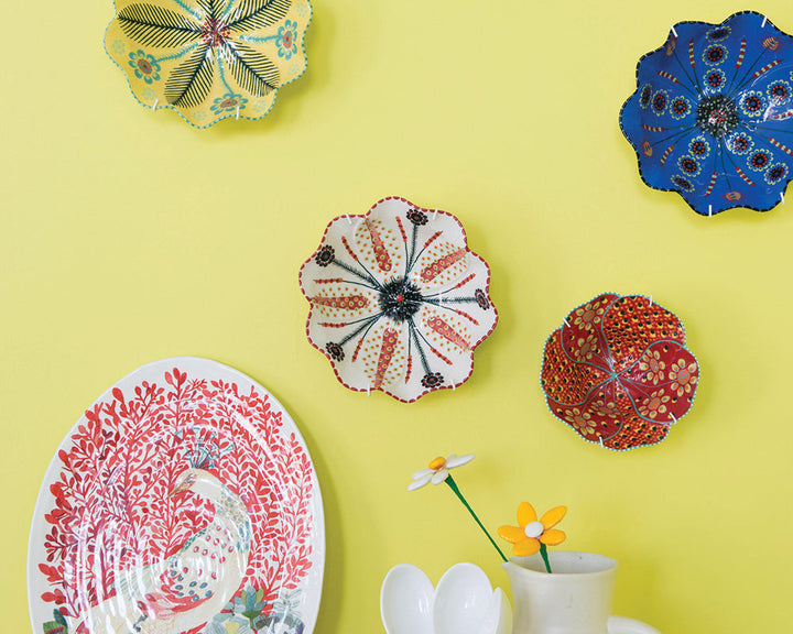 Yellowcake 279 paint by Farrow & Ball used on a wall with plates