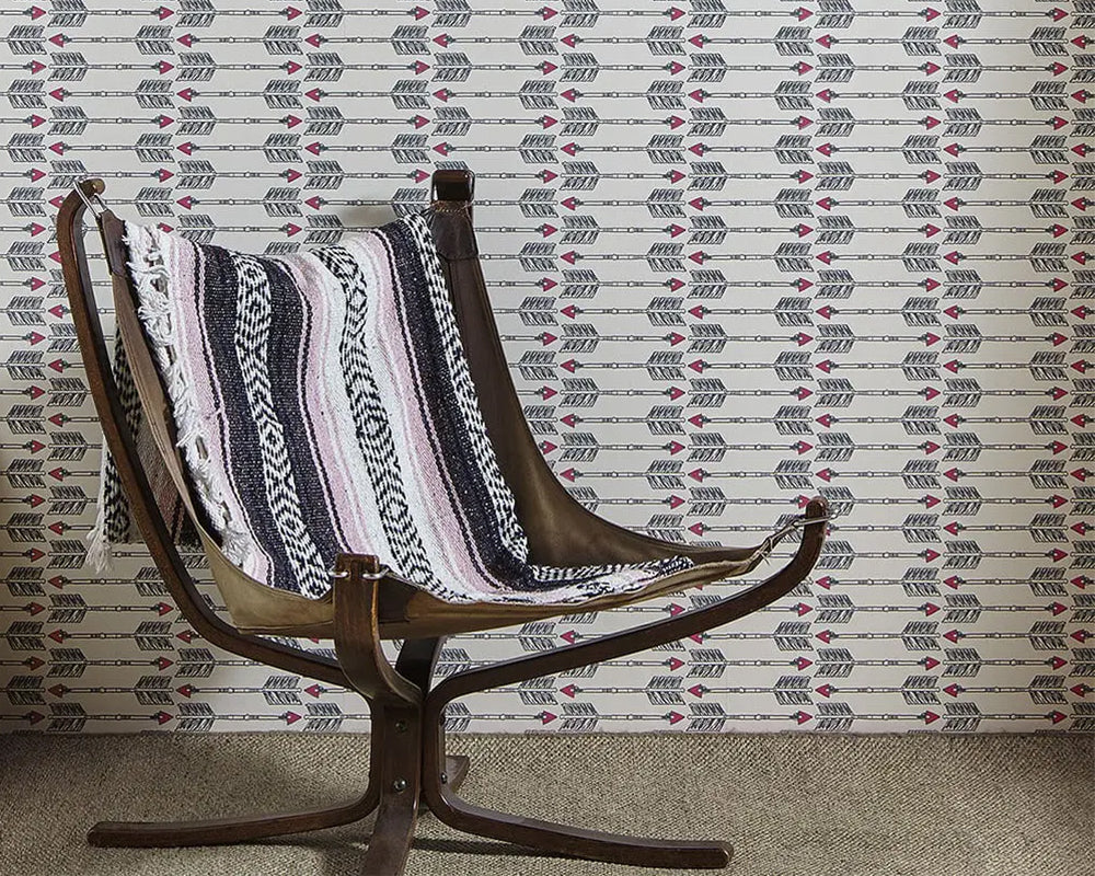 Barneby Gates Arrow Wallpaper in Charcoal Pink in a living room setting