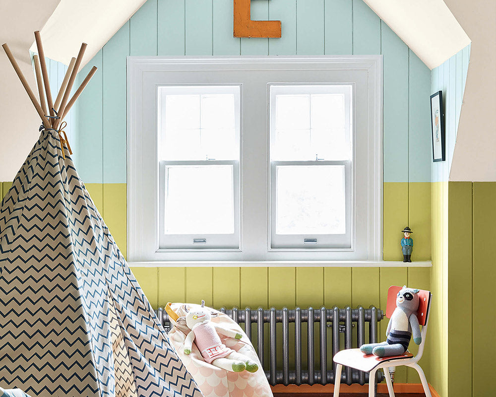 Little Greene Pale Lime 70 Paint on cladding in a childs playroom