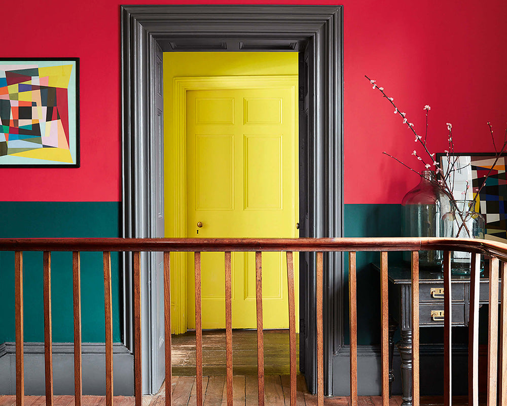 Little Greene Trumpet 196 Paint on a door in a red hallway