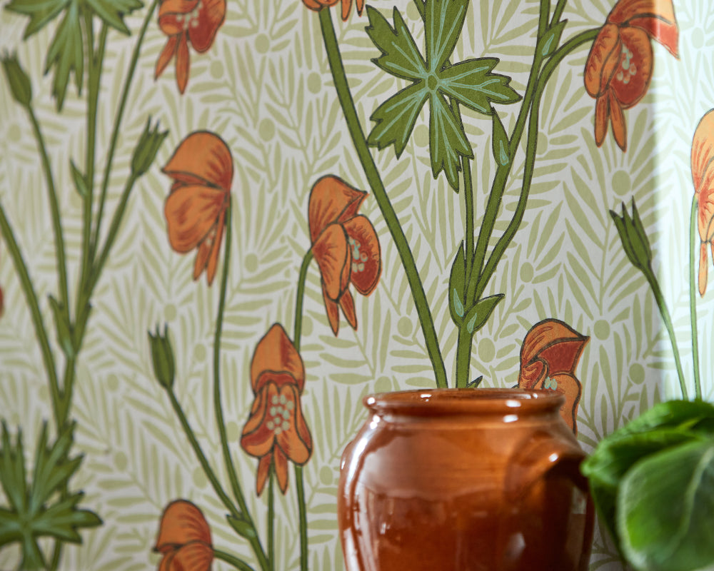 Morris & Co Monkshood Wallpaper in Tangerine & Sage in a living room set up detail