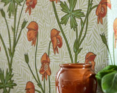Morris & Co Monkshood Wallpaper in Tangerine & Sage in a living room set up detail