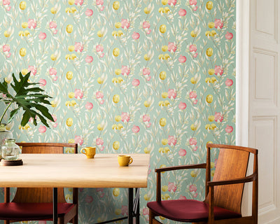 OHPOPSI Pomegranate Trail Wallpaper in Seaform on a room wall