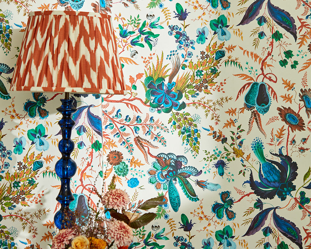 Harlequin Wonderland Floral Wallpaper in Spinel/Peridot/Pearl close up in a bedroom set up