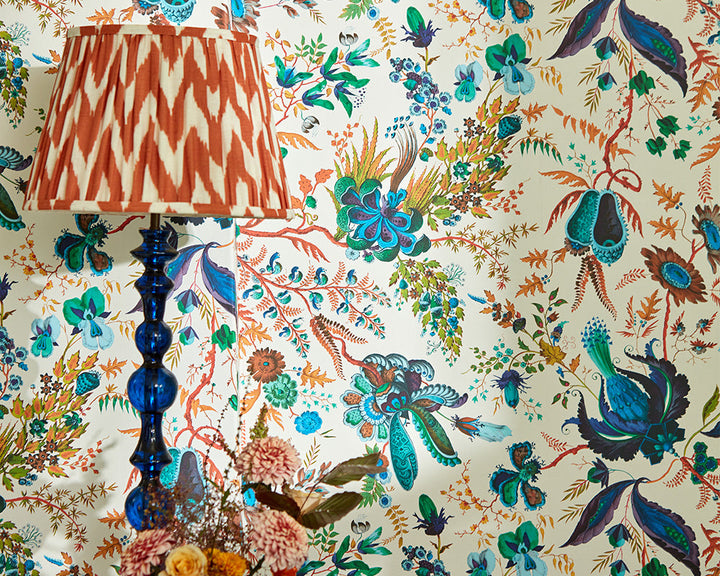 Harlequin Wonderland Floral Wallpaper in Spinel/Peridot/Pearl close up in a bedroom set up