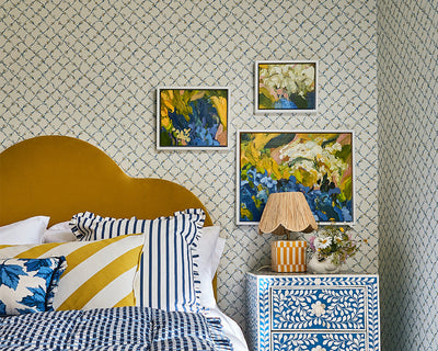 Harlequin Daisy Trellis Wallpaper in a bedroom set up in Lapis/Pearl