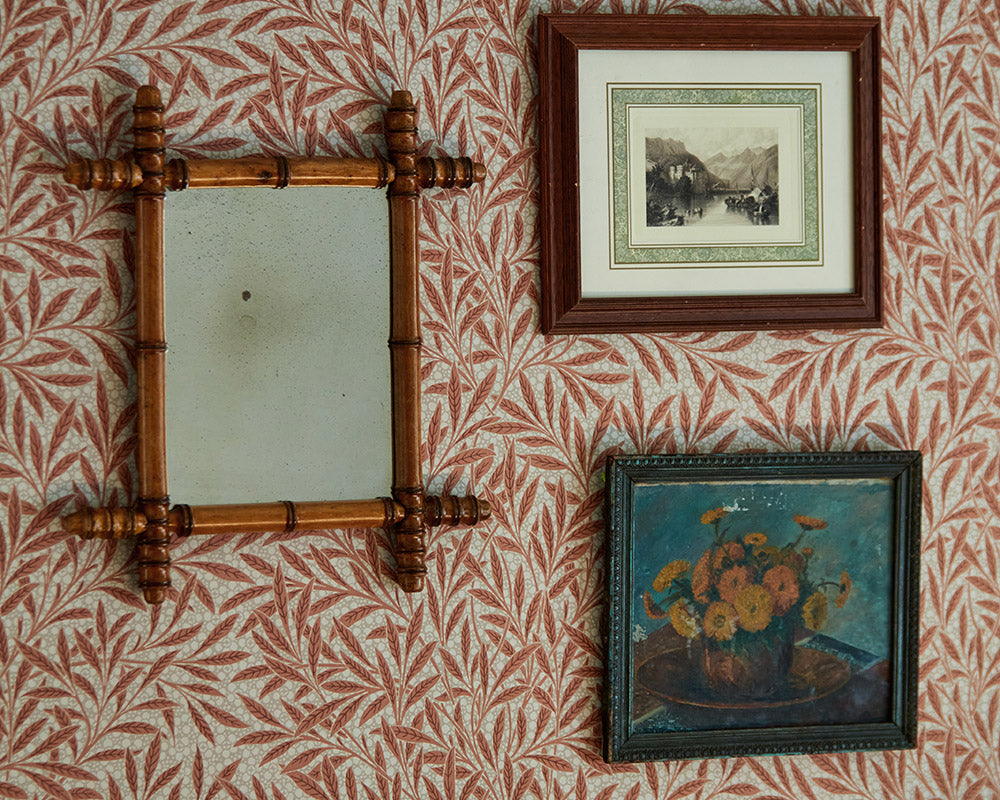 Morris & Co Emery's Willow Wallpaper behind picture frames