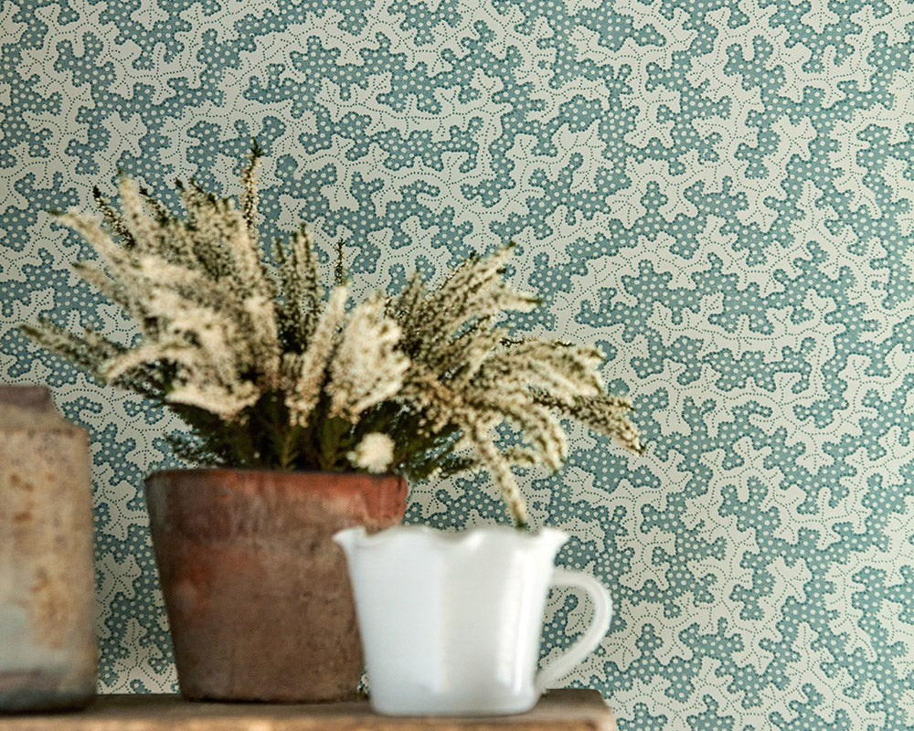 A close up of Sanderson Truffle Wallpaper in a room